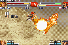 The King of Fighters EX2: Howling Blood (Game Boy Advance) screenshot: Reiji uses his DM Meteor Great Wolf Kick to mark some air stomp-flaming hits on Ralf during a jump.