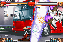 The King of Fighters EX2: Howling Blood (Game Boy Advance) screenshot: Moe Habana: smashed by the big purple flaming "tower" of Iori's DM Concealed 1207 Gloom Gouger...