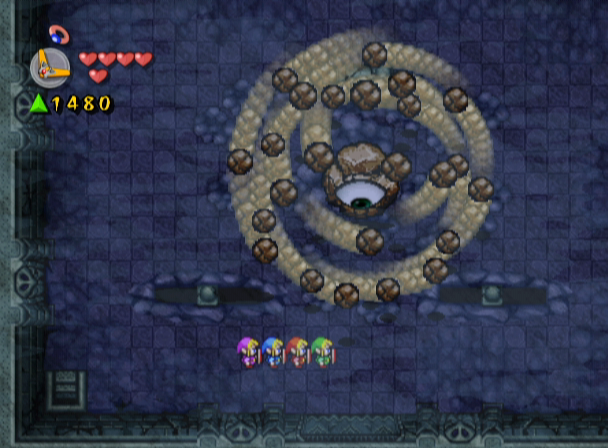 The Legend of Zelda: Four Swords Adventures (GameCube) screenshot: A giant rock eye! Now how can I defeat this thing?