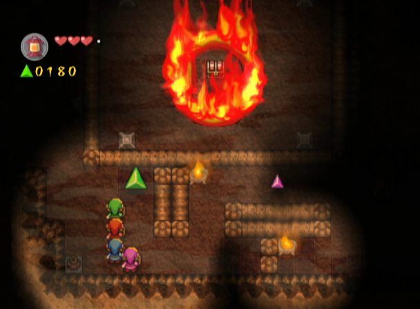 The Legend of Zelda: Four Swords Adventures (GameCube) screenshot: You'll need to find a way to put out that fire