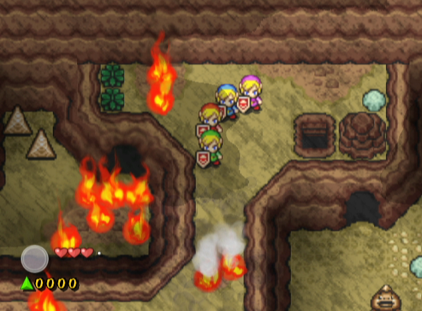 The Legend of Zelda: Four Swords Adventures (GameCube) screenshot: Find some water to put out these fires