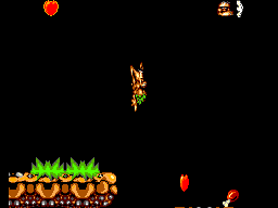 Chuck Rock (SEGA Master System) screenshot: Chuck jumps high for a fat caveman
