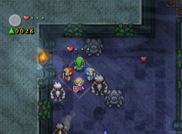 The Legend of Zelda: Four Swords Adventures (GameCube) screenshot: Fighting off enemies in a diamond formation