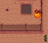 Cannon Fodder (Game Boy Color) screenshot: A enemy torn to pieces.