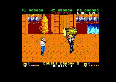 Double Dragon II: The Revenge (Amstrad CPC) screenshot: Carrying a log (128K floppy disk version).