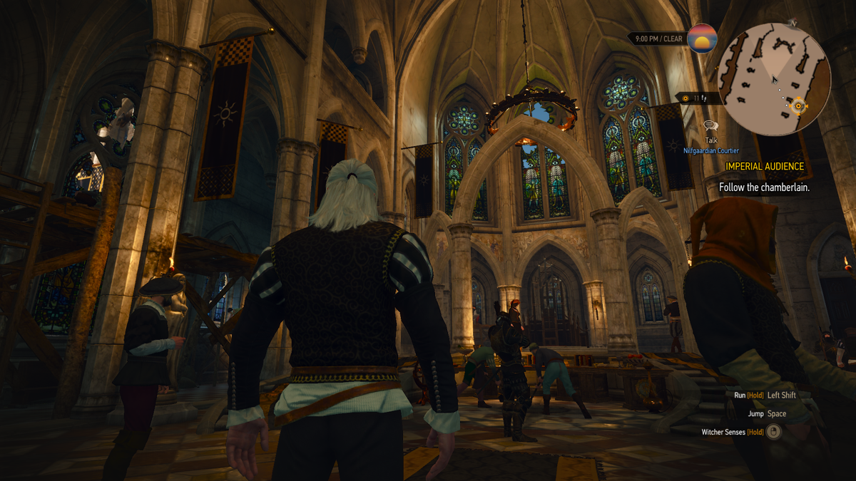 The Witcher 3: Wild Hunt (Windows) screenshot: The Royal Palace of Vizima. Beautiful decorations. Geralt is clad in a courtier outfit - makes him look pretty gay, if you ask me