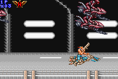Contra Advance: The Alien Wars EX (Game Boy Advance) screenshot: In this level, ride in a motorcycle and shoot the upper enemies when you've a chance.