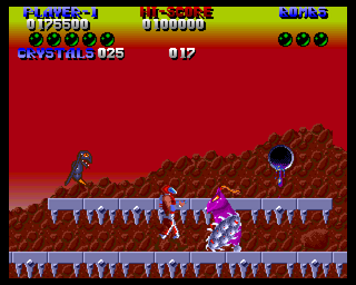 Plexu: The Time Travellers (Amiga) screenshot: Purple guy with a chainsaw