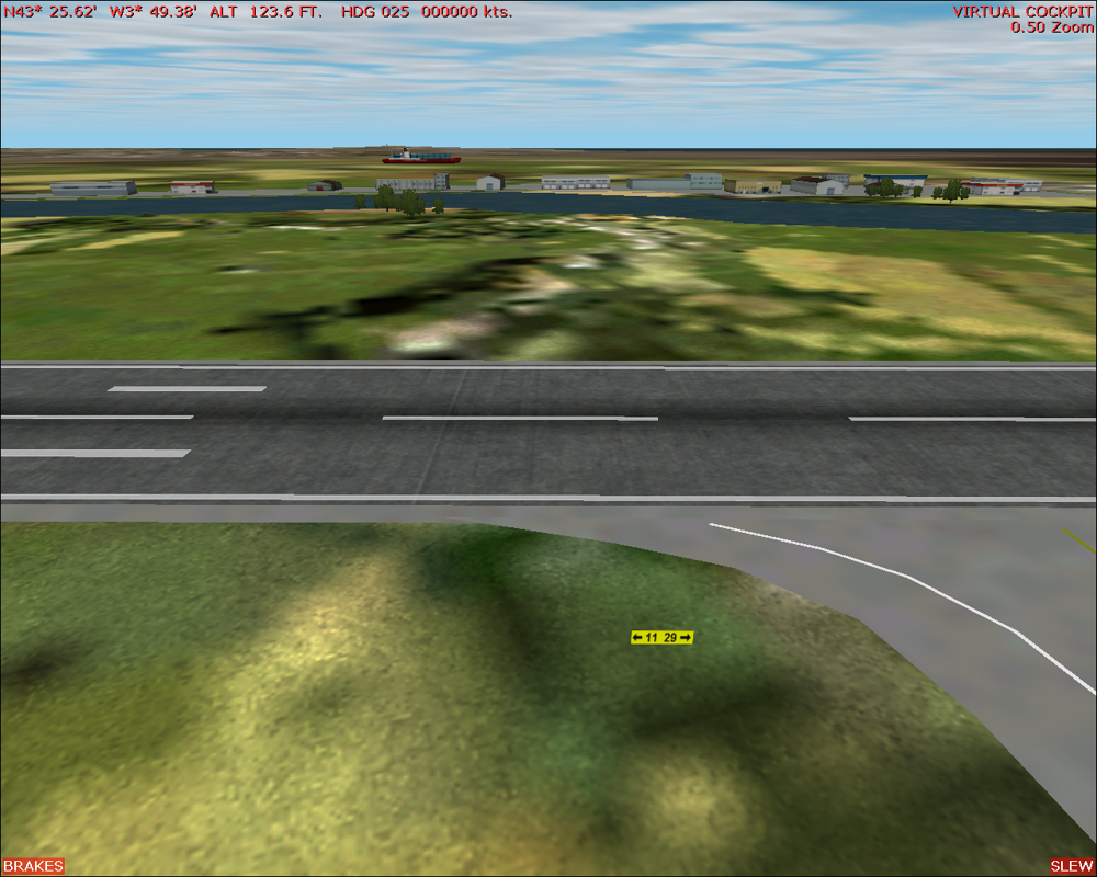 Scenery Spain 2: Spanish Airports (Windows) screenshot: Santander airport - just across the runway there should be a bay, but FS2002 shows only land, so the ship is stranded.