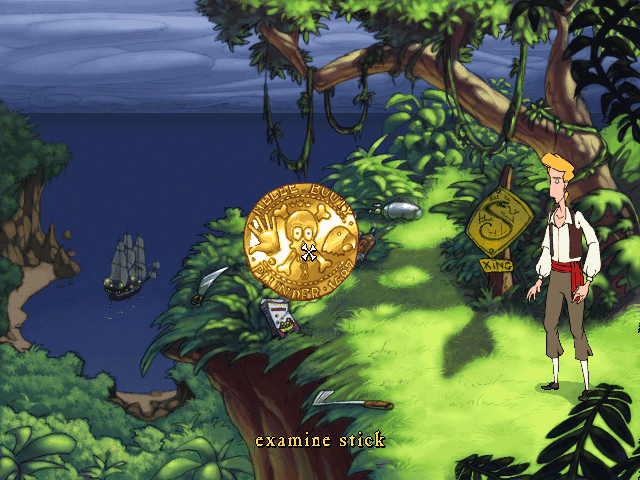 The Curse of Monkey Island (Windows) screenshot: This golden coin is the new interface, each picture representing a different action