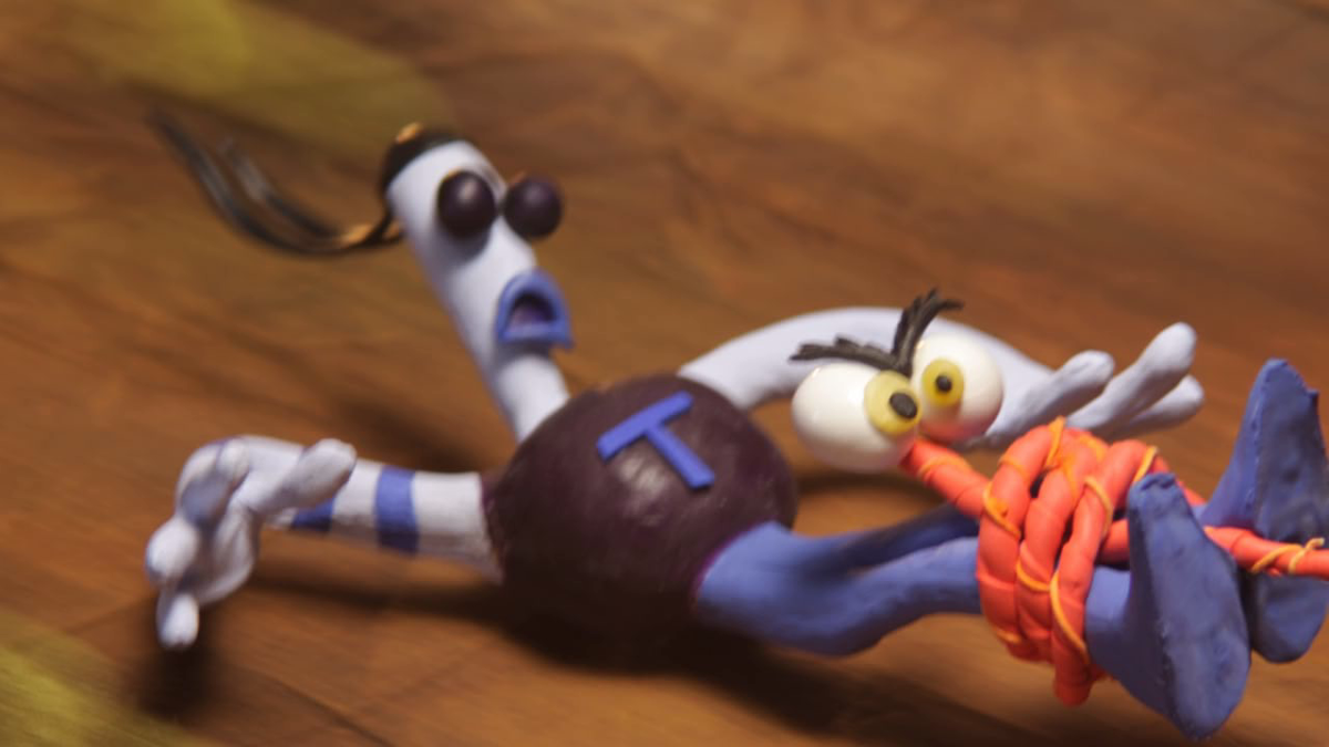 Armikrog. (Windows) screenshot: Tommy is snared by the Zipkicker's tongue.