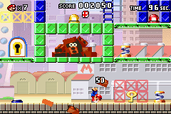 Mario vs. Donkey Kong (Game Boy Advance) screenshot: Doing a hand stand is the best way to avoid the falling bricks