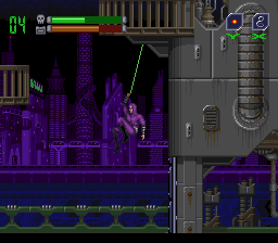 Phantom 2040 (SNES) screenshot: Our hero is using the "Inductance Rope" to swing to the next balcony