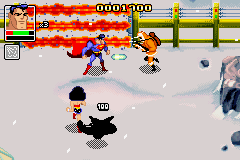 Justice League: Chronicles (Game Boy Advance) screenshot: Superman uses his frost-breath in front of an electric fence.