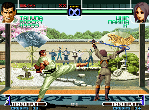 The King of Fighters 2002: Challenge to Ultimate Battle (Neo Geo) screenshot: Takuma's Blow Away Attack and Whip's Strings Shot Type C "Code: Shouri": which will be superior?