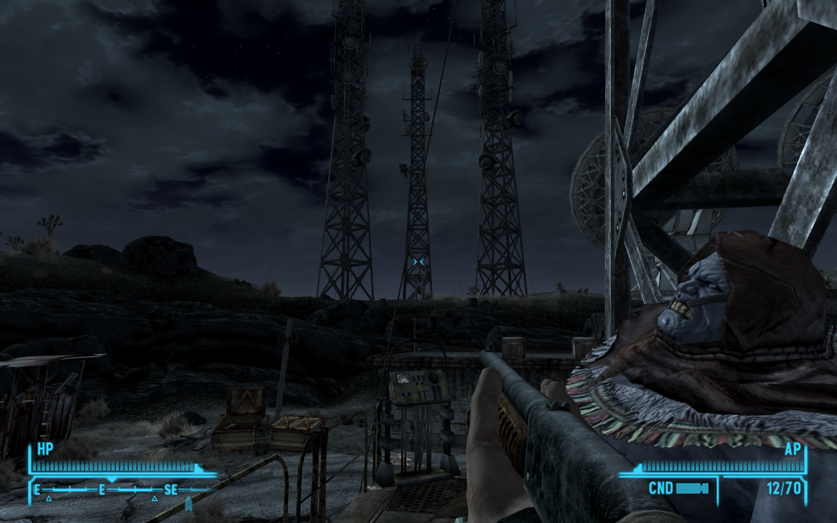 Fallout: New Vegas (Windows) screenshot: It was a wonderful, quiet night, and I decided to spend it on a radio tower, with the corpse of a Supermutant. We really bonded then