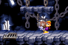 Rayman: Raving Rabbids (Game Boy Advance) screenshot: Rayman can use these explosive barrels to break open certain doors