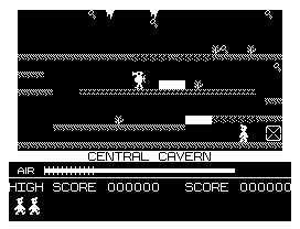 Manic Miner (Dragon 32/64) screenshot: Lots of keys scattered over the cavern