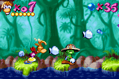 Rayman: 10th Anniversary (Game Boy Advance) screenshot: Rayman must punch-beat a Small Livingstone in his way: and he is about to get it!