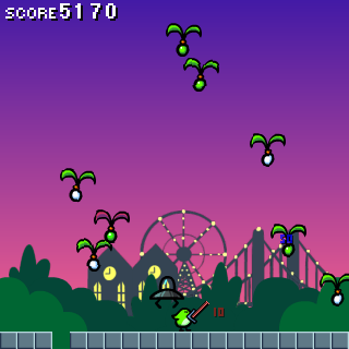 Pyoro (Windows) screenshot: It gets a little busier; a first hole appears and there are some buildings in the background.