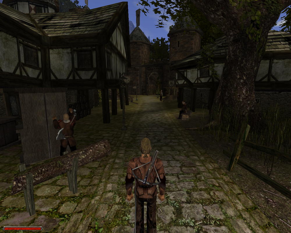 Gothic II (Windows) screenshot: Exploring the only city on Khorinis. It's pretty big and has quite a few inhabitants who seem to be busy