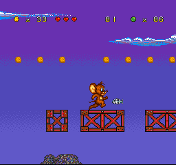 Tom and Jerry (SNES) screenshot: While Jerry crosses a row of ledges, he must be quick to not be hit-damaged by a falling fish spine!