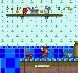 Tom and Jerry (SNES) screenshot: Jerry The Mouse's adventure continues, this time in a kitchen with lots of walk-pestering foodstuff!