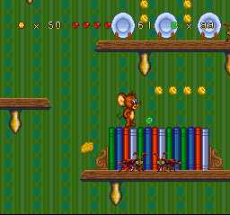 Tom and Jerry (SNES) screenshot: While Jerry walks over a row of books, he finds a marble and a minor row of small cheese balls...