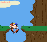 Quest for the Shaven Yak starring Ren Hoëk & Stimpy (Game Gear) screenshot: Stimpy can break wood branches with his special smashing jump.