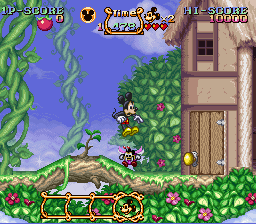 The Magical Quest Starring Mickey Mouse (SNES) screenshot: The first level, jumping on a bee.