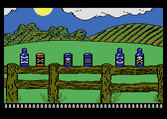 Barnyard Blaster (Atari 8-bit) screenshot: Shoot some cans and bottles on the fence