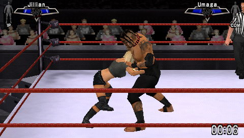WWE Smackdown vs. Raw 2007 (PSP) screenshot: Jillian trying to pick up Umaga.