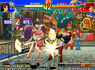 The King of Fighters '97 (Neo Geo) screenshot: Mai Shiranui attacks Iori Yagami connecting the first 2 hits of her fan-swinging move Hakuro no Mai.