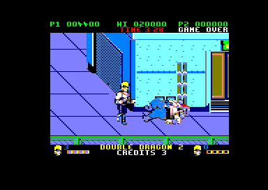 Double Dragon II: The Revenge (Amstrad CPC) screenshot: Boss down on the ground (128K floppy disk version)