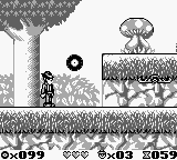 The Blues Brothers: Jukebox Adventure (Game Boy) screenshot: A big mushroom is on the hill