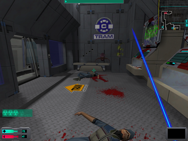 System Shock 2 (Windows) screenshot: One of my favorite activities when waiting for a tram is looking at a crazy giant spider about to leap at me from that bench