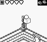 Monster Max (Game Boy) screenshot: Reaching for the force field