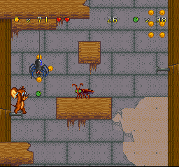 Tom and Jerry (SNES) screenshot: Jerry's marble throwing continues: now, the current target is a cockroach... or a pestering spider?