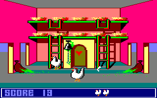 Chicken Chase (Amstrad CPC) screenshot: A worm decides to pop in and say hello