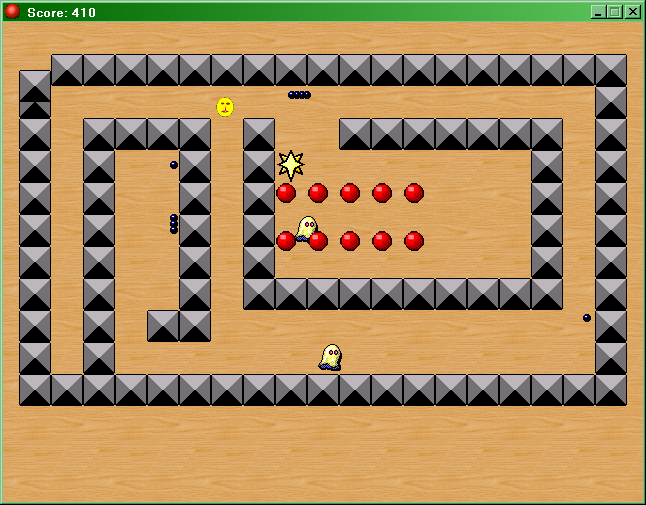 Pac-Man Revenge (Windows) screenshot: Shooting some bullets at ghosts. As you can see the bullets get stuck in walls and remain there.