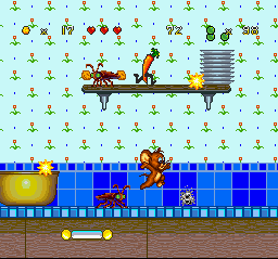 Tom and Jerry (SNES) screenshot: In an attempt to hit-defeat one of the current enemies (cockroach and spinning rabbit), Jerry jumps.
