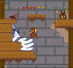 Tom and Jerry (SNES) screenshot: Jerry throws a marble in direction to Tom's face, and he strikes back with a quick-hand-claw attack.