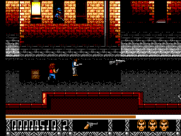 Predator 2 (SEGA Master System) screenshot: Bad guys are shooting from the windows. You see a large gun on the floor