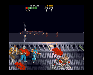 Ninja Gaiden (Amiga) screenshot: An enemy on a motorcycle. The Statue of Liberty is seen in the background...
