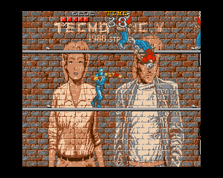 Ninja Gaiden (Amiga) screenshot: Punching an enemy, making him fall down from the walkway.