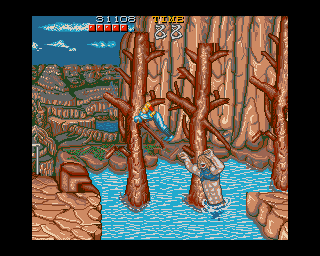 Ninja Gaiden (Amiga) screenshot: This is a tricky place. The ninja dies if he falls into the water. I guess he skipped the swimming-lessons at ninja-school.