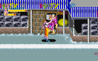 Captain Commando (PlayStation) screenshot: Grabbing enemy. Note that the screens may show more of the playfield than on a standard TV that was available at the time of release.
