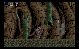 Shadow of the Beast (Amiga) screenshot: Giant snakes are emerging from the ground and ceiling.