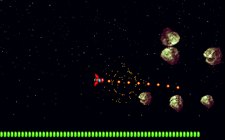 Blastocyst (DOS) screenshot: Rock goes boom, with some sweet particle effects.