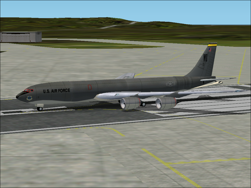 Military Collection (Windows) screenshot: Outside view of the KC135R, on runway 6R at Anderson AFB in Guam. There are no moving doors to open, even if there should be a small hatch below the cockpit for the crew.